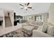 Spacious living room features a comfortable sectional sofa, modern decor, and an open floor plan at 11464 Chilly Water Ct, Riverview, FL 33569