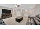 Upstairs living room offers lots of space, large TV, and comfortable seating at 11464 Chilly Water Ct, Riverview, FL 33569