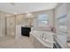 Main bathroom featuring a soaking tub, glass shower, and vanity with a granite countertop at 11464 Chilly Water Ct, Riverview, FL 33569
