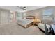 Bright main bedroom featuring neutral tones, ceiling fan, and ample natural light at 11464 Chilly Water Ct, Riverview, FL 33569
