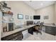 Home office featuring a granite desktop, built-in drawers, and a rolling chair at 11464 Chilly Water Ct, Riverview, FL 33569