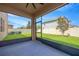 Screened patio with a ceiling fan overlooking a green lawn and fencing at 11464 Chilly Water Ct, Riverview, FL 33569