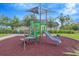 Community playground with play structure and safety surface providing a fun and secure environment for children at 11464 Chilly Water Ct, Riverview, FL 33569