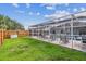 Large backyard featuring a screened-in pool, perfect for outdoor entertaining and relaxation at 12413 Dawn Vista Dr, Riverview, FL 33578