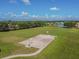 Community basketball court with expansive green space, perfect for recreational activities at 12413 Dawn Vista Dr, Riverview, FL 33578