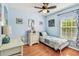 Comfortable bedroom with a bright window, desk, and charming decor for a relaxing atmosphere at 12413 Dawn Vista Dr, Riverview, FL 33578
