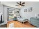 Sun-filled bedroom with coastal decor and wood floors at 12413 Dawn Vista Dr, Riverview, FL 33578