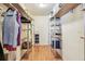 Organized walk-in closet with shelves and hanging storage at 12413 Dawn Vista Dr, Riverview, FL 33578