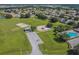 Aerial shot of the community featuring recreational areas, a playground, and swimming pool at 12413 Dawn Vista Dr, Riverview, FL 33578