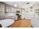 Bright kitchen featuring modern appliances, ample cabinet space, and hardwood floors at 12413 Dawn Vista Dr, Riverview, FL 33578