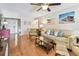 Inviting living room featuring hardwood floors and a comfortable seating arrangement at 12413 Dawn Vista Dr, Riverview, FL 33578