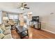 Comfortable living room with hardwood floors, fan and open concept layout at 12413 Dawn Vista Dr, Riverview, FL 33578