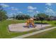 Neighborhood playground with various play structures and open green spaces for Gathering fun at 12413 Dawn Vista Dr, Riverview, FL 33578