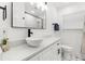 Modern bathroom showcasing a stylish bowl sink, updated fixtures, and a spacious countertop at 1275 Palm St, Clearwater, FL 33755