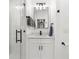 Stylish bathroom featuring a glass-enclosed shower, modern vanity, and elegant fixtures at 1275 Palm St, Clearwater, FL 33755