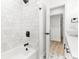 Elegant bathroom featuring a tiled shower and tub combo with modern fixtures and stylish design at 1275 Palm St, Clearwater, FL 33755