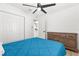 Bright bedroom with a ceiling fan, closet, and ensuite bathroom for added convenience and comfort at 1275 Palm St, Clearwater, FL 33755