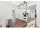 Dining room open to the kitchen featuring modern light fixture and matching dining set at 1275 Palm St, Clearwater, FL 33755