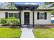 Close-up of inviting front porch and entry of a single-story home at 1275 Palm St, Clearwater, FL 33755