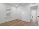 This bright bedroom with updated vinyl flooring has a large window with natural light at 1435 Prescott S St, St Petersburg, FL 33712