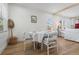 Dining area showcasing hardwood floors, natural light, and an open flow to the living space at 1435 Prescott S St, St Petersburg, FL 33712