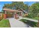 Inviting single-Gathering home showcasing a covered entryway and well-maintained landscaping at 1435 Prescott S St, St Petersburg, FL 33712