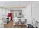 Bright kitchen features a red retro refrigerator, white cabinets, and eat-in breakfast bar with modern bar stools at 1435 Prescott S St, St Petersburg, FL 33712
