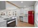 An open concept kitchen offers modern appliances, natural light, and views of the bright living room at 1435 Prescott S St, St Petersburg, FL 33712