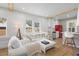 Stylish living room with hardwood floors, neutral decor, and an open layout to the kitchen at 1435 Prescott S St, St Petersburg, FL 33712
