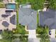 Aerial view of a home with well-maintained landscaping and a private pool at 15217 Octavia Ln, Odessa, FL 33556