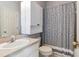 Full bathroom with a vanity, decorative mirror, toilet, and shower with curtain at 15217 Octavia Ln, Odessa, FL 33556