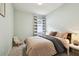 Relaxing bedroom with soft, natural light and a cozy chair offers a serene personal space at 15217 Octavia Ln, Odessa, FL 33556
