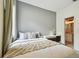Comfortable bedroom setup with a view to the ensuite bathroom offering a cozy, private retreat at 15217 Octavia Ln, Odessa, FL 33556