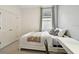 Bedroom with a bed, a side table and large windows with a view to the outside at 15217 Octavia Ln, Odessa, FL 33556