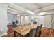 Elegant dining room featuring hardwood floors, modern lighting fixtures, and an open floor plan at 15217 Octavia Ln, Odessa, FL 33556
