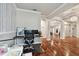 Bright home office featuring hardwood floors, neutral walls, and an open floor plan at 15217 Octavia Ln, Odessa, FL 33556