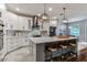 Beautiful kitchen features stainless steel appliances, a large island, and sleek cabinetry at 15217 Octavia Ln, Odessa, FL 33556