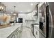 Modern kitchen with stainless appliances, subway tile backsplash, and plenty of cabinet storage at 15217 Octavia Ln, Odessa, FL 33556