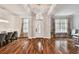 Spacious living room featuring hardwood floors, a dining area and an open floor plan at 15217 Octavia Ln, Odessa, FL 33556