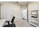 Bright office space features neutral paint, carpeting, large closet, and shelving for optimal organization at 15217 Octavia Ln, Odessa, FL 33556