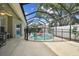 Inviting screened-in pool area with -safe fencing and a refreshing pool at 15217 Octavia Ln, Odessa, FL 33556