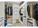 Organized walk-in closet features custom shelving, storage, and a dressing area at 15217 Octavia Ln, Odessa, FL 33556