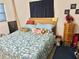 Cozy bedroom features a bed, side table, and personal decorations at 1605 Logan St, Clearwater, FL 33755