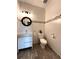 Well-lit powder room featuring a vanity, contemporary accents, and tiled walls at 19636 Long Lake Ranch Blvd, Lutz, FL 33558