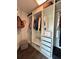 Walk-in closet with custom shelving and storage solutions, maximizing space and organization at 19636 Long Lake Ranch Blvd, Lutz, FL 33558