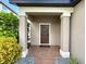 Welcoming front entrance with a brick pathway, stylish front door, and manicured landscaping at 19636 Long Lake Ranch Blvd, Lutz, FL 33558
