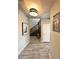 Hallway with wood-style tile flooring leading to the staircase and other rooms at 19636 Long Lake Ranch Blvd, Lutz, FL 33558