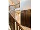 Hallway showing wooden staircase, barn door and light, ceramic tiled floor at 19636 Long Lake Ranch Blvd, Lutz, FL 33558
