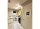 Well-lit laundry room with modern washer and dryer, sink, and playful decor at 19636 Long Lake Ranch Blvd, Lutz, FL 33558