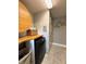 Convenient laundry area with modern appliances, storage, and tiled floor at 19636 Long Lake Ranch Blvd, Lutz, FL 33558
